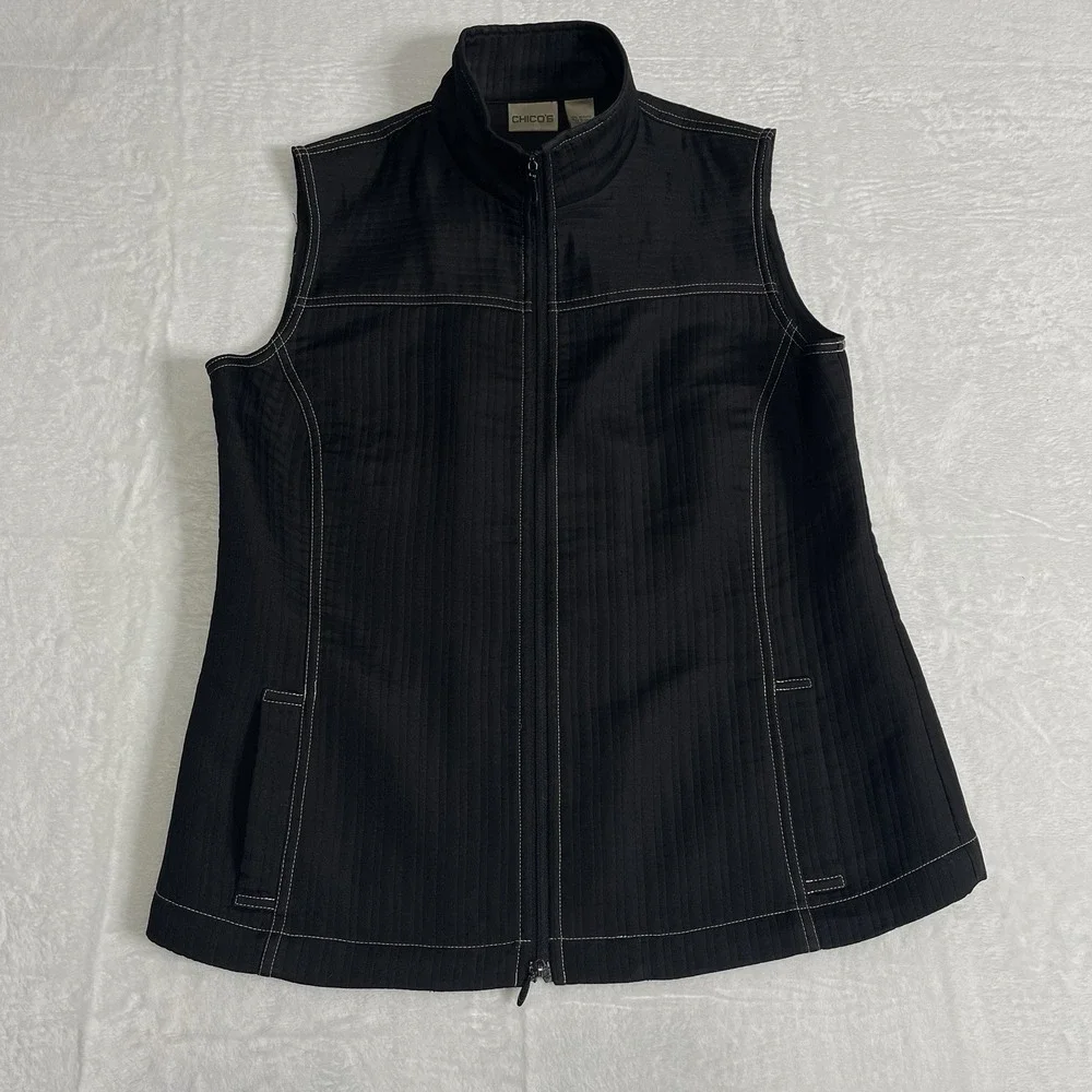Chico's Vest Size 1 Zip up front pockets on front Black With White Stitching‎